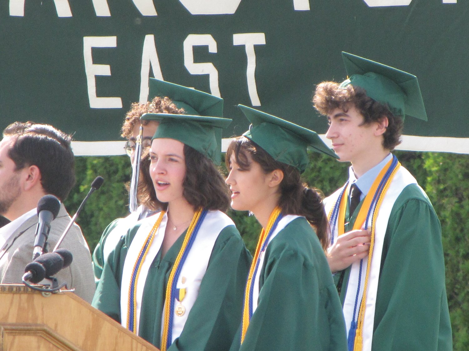 SINGING THE ANTHEM: Cranston East Choir members Mina Grady and Aislinn Baxter perform the national anthem at the start of Saturday’s commencement exercises.